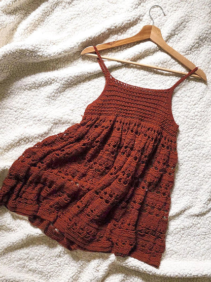 Detail of the decorative crochet texture on the babydoll dress