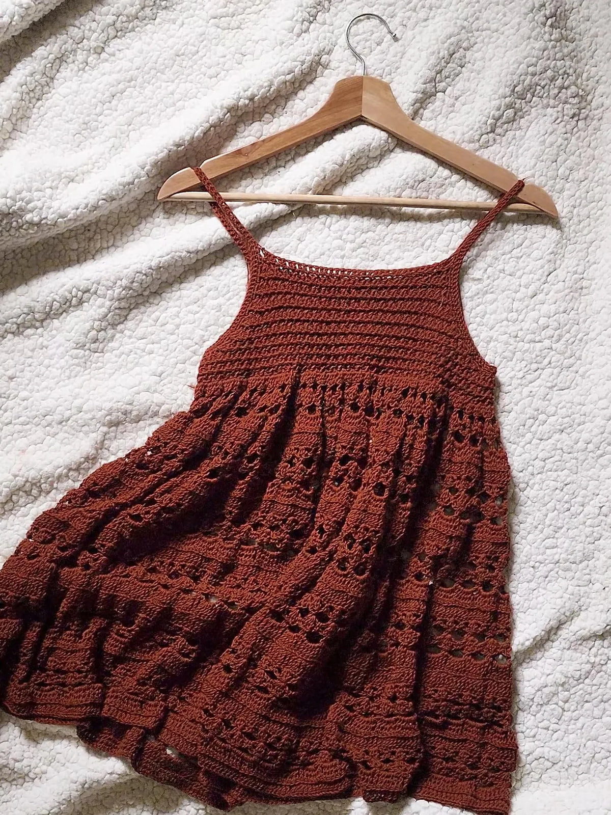 Close-up of the open crochet stitch pattern on the dress