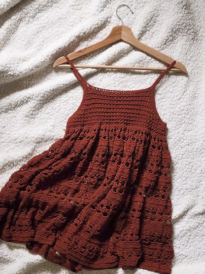 Close-up of the open crochet stitch pattern on the dress