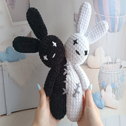 Side view of the creepy-cute two-headed crochet bunny