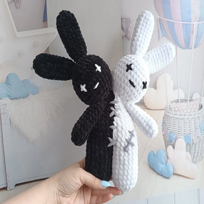 Two-headed amigurumi bunny styled in a Halloween setting