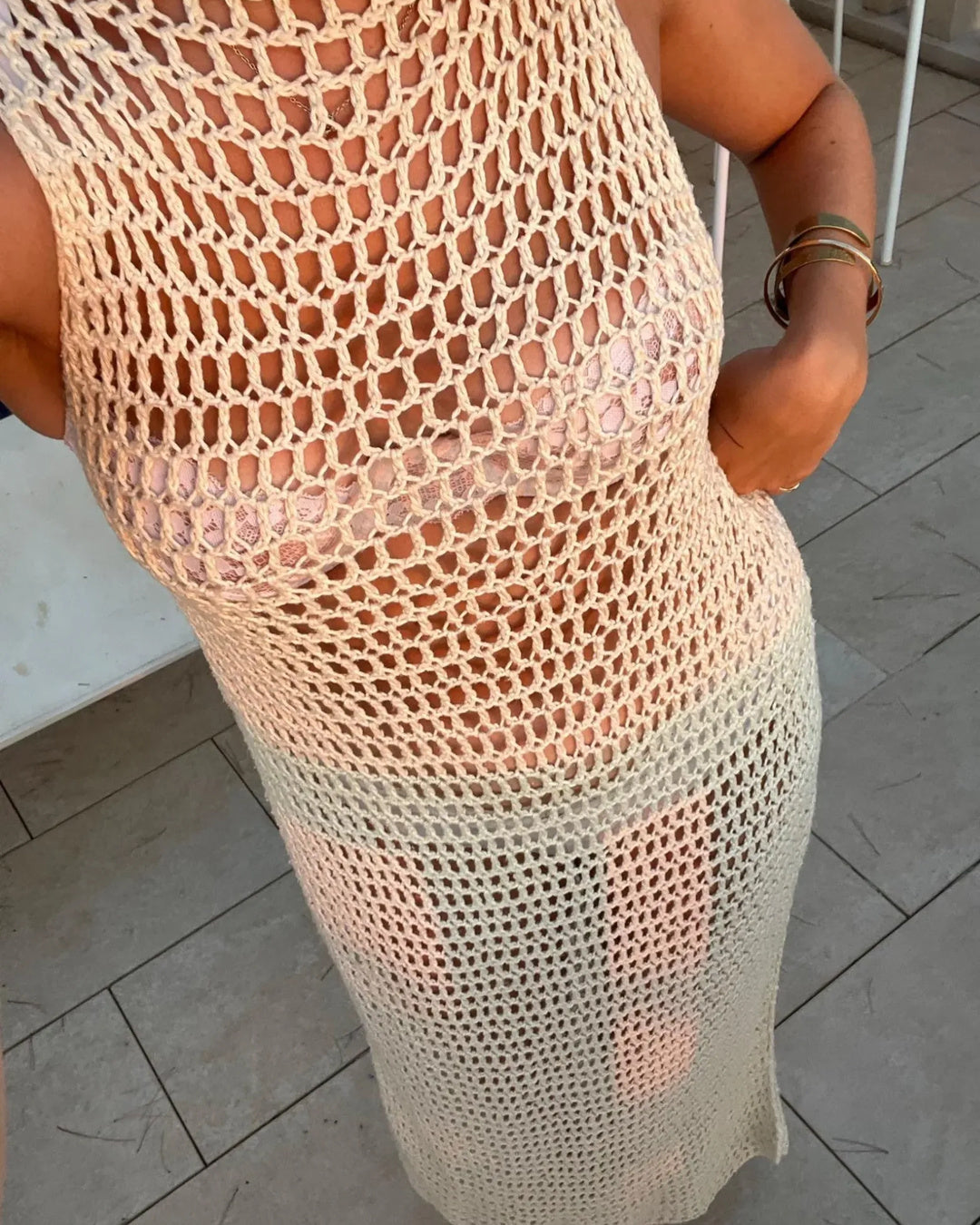 Close-up of the open mesh crochet stitch pattern of the Kiki Dress