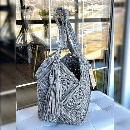 Detail of the tassel charm on the crochet market bag