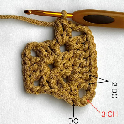 Crocheted market bag hanging from a hook