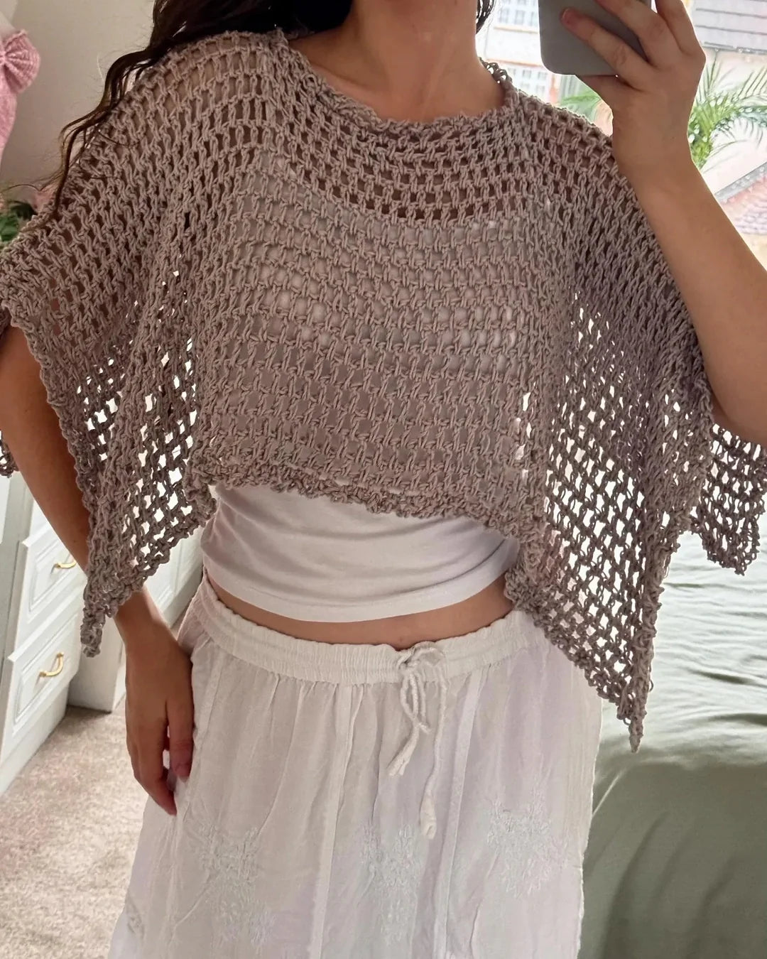 Selenya crochet shawl poncho styled over a dress