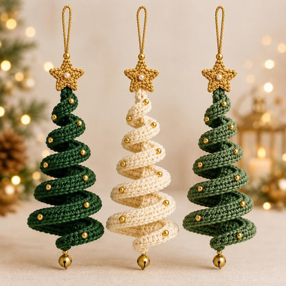 Three spiral crochet Christmas tree ornaments in forest green, ivory and sage with gold stars, beads and bells