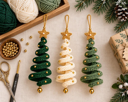Spiral tree ornaments beside yarn, hook, beads and scissors