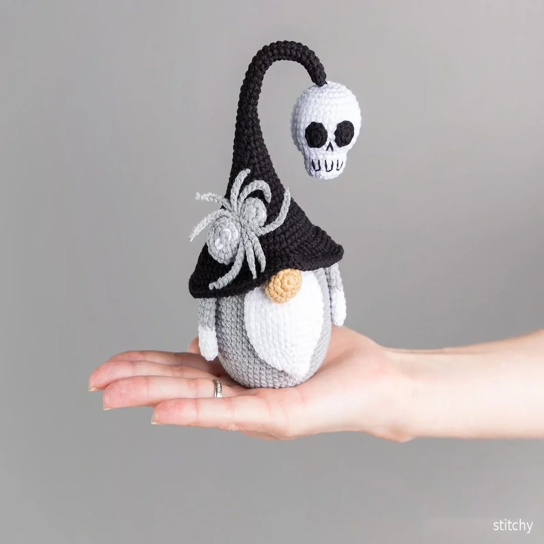 Detail of the crocheted skull held by the Halloween gnome