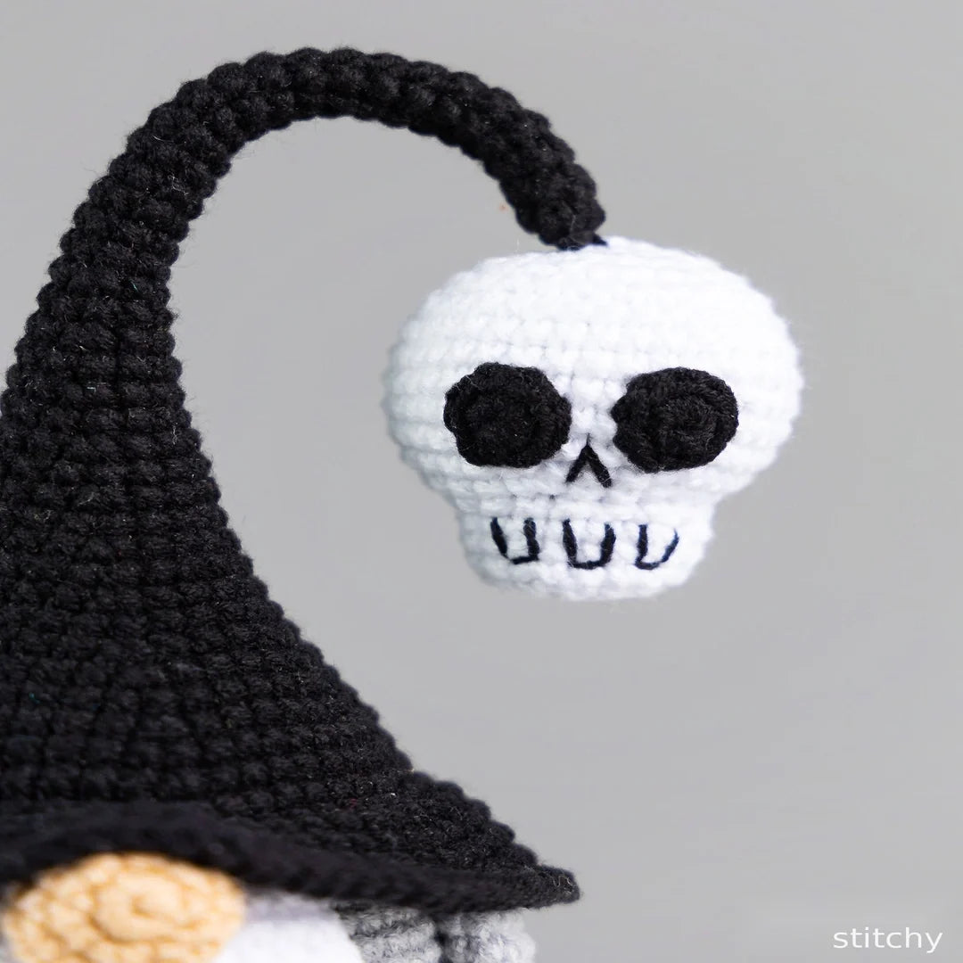 Crochet Halloween gnome in a spooky tabletop arrangement